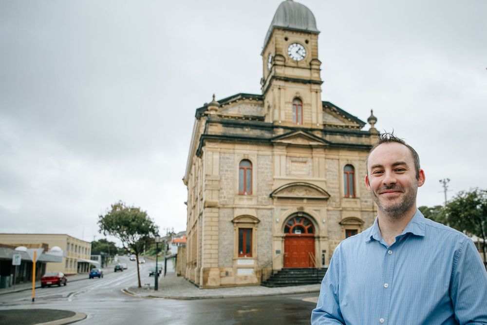 Architectural photos of a historic church building exterior under cloudy skies.