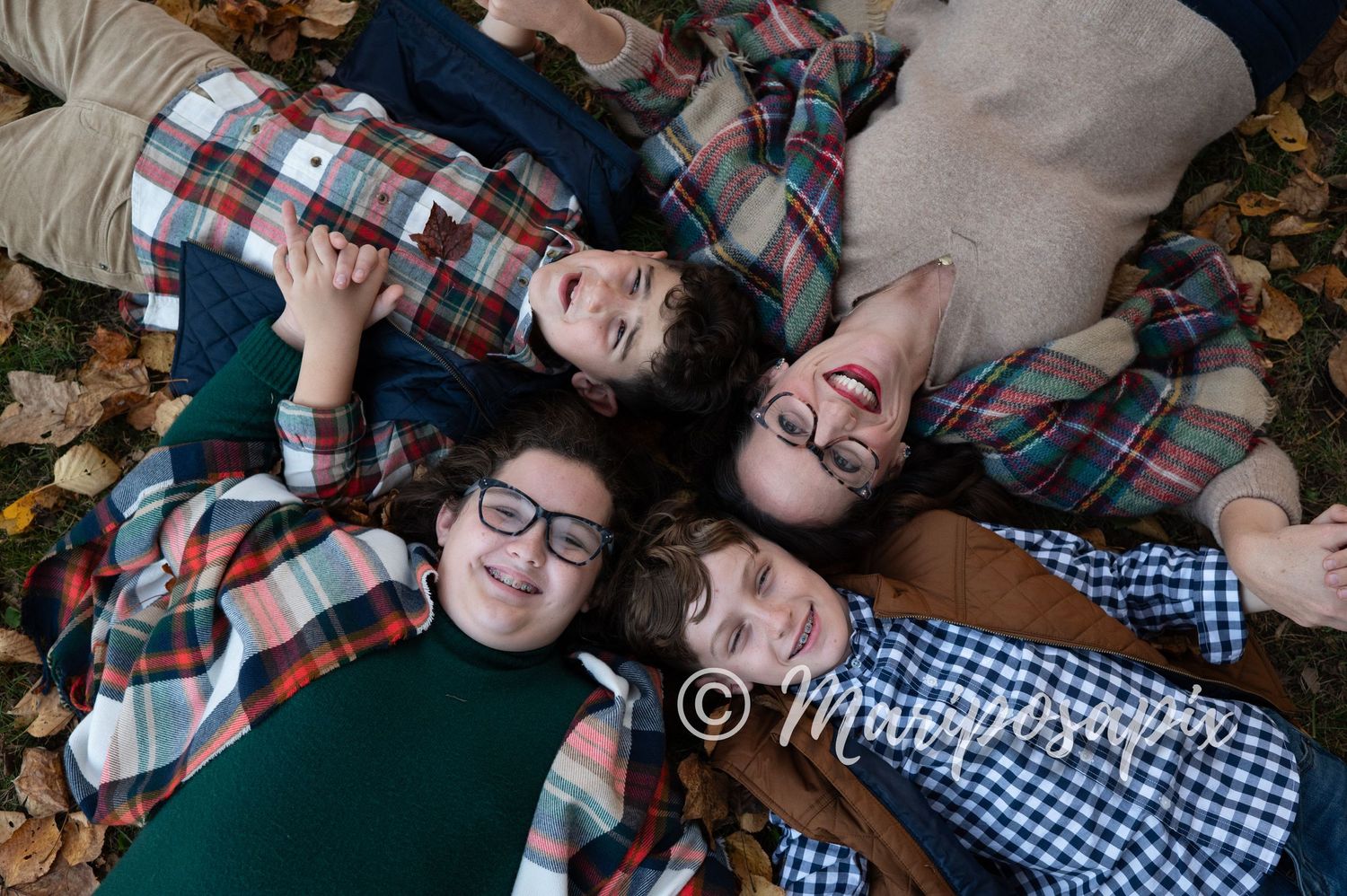 fall family photos with leaves and laughing