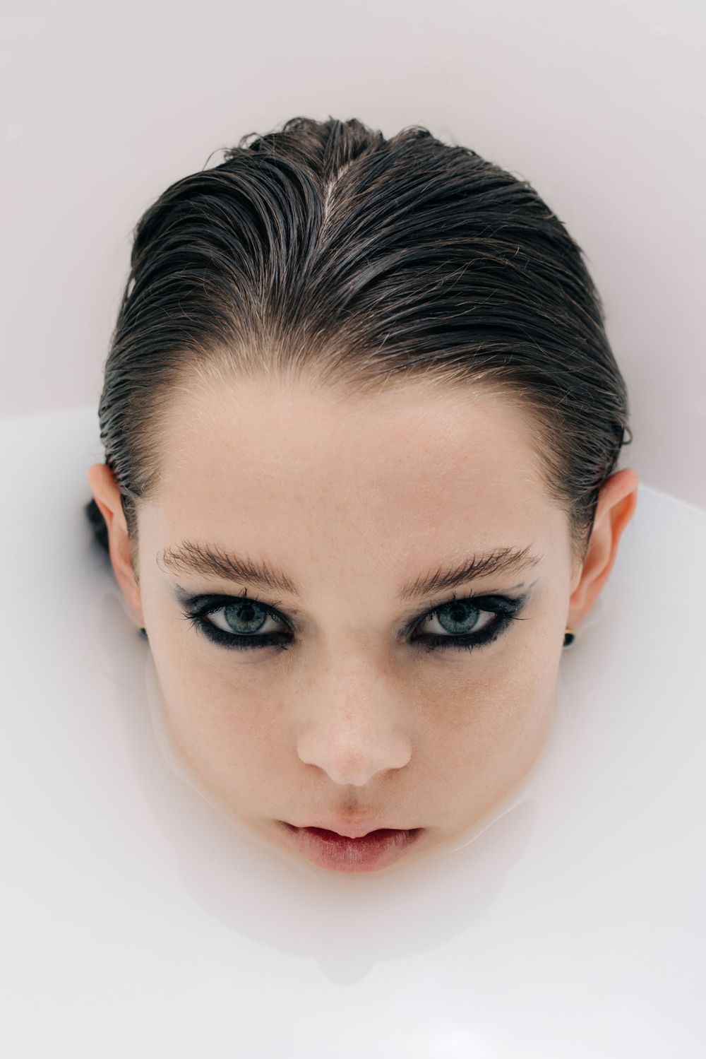Face on water editorial shot by Bill Chen photography