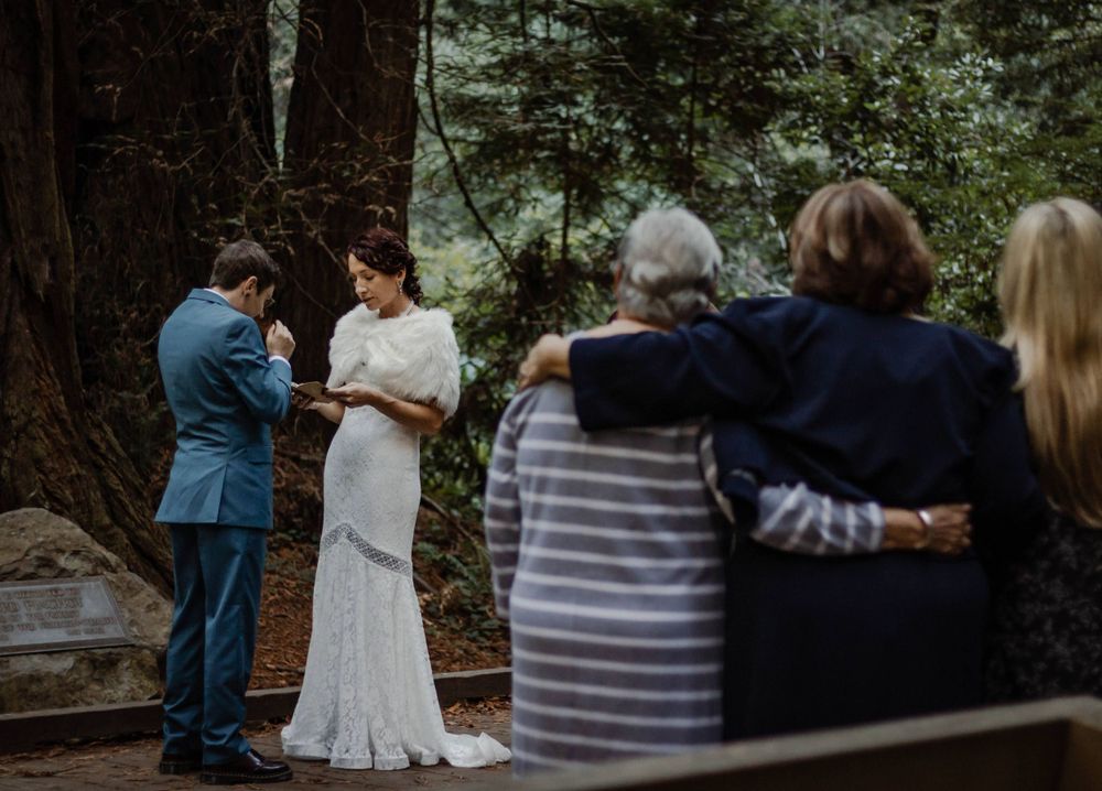 wedding in muir woods large trees reading vows