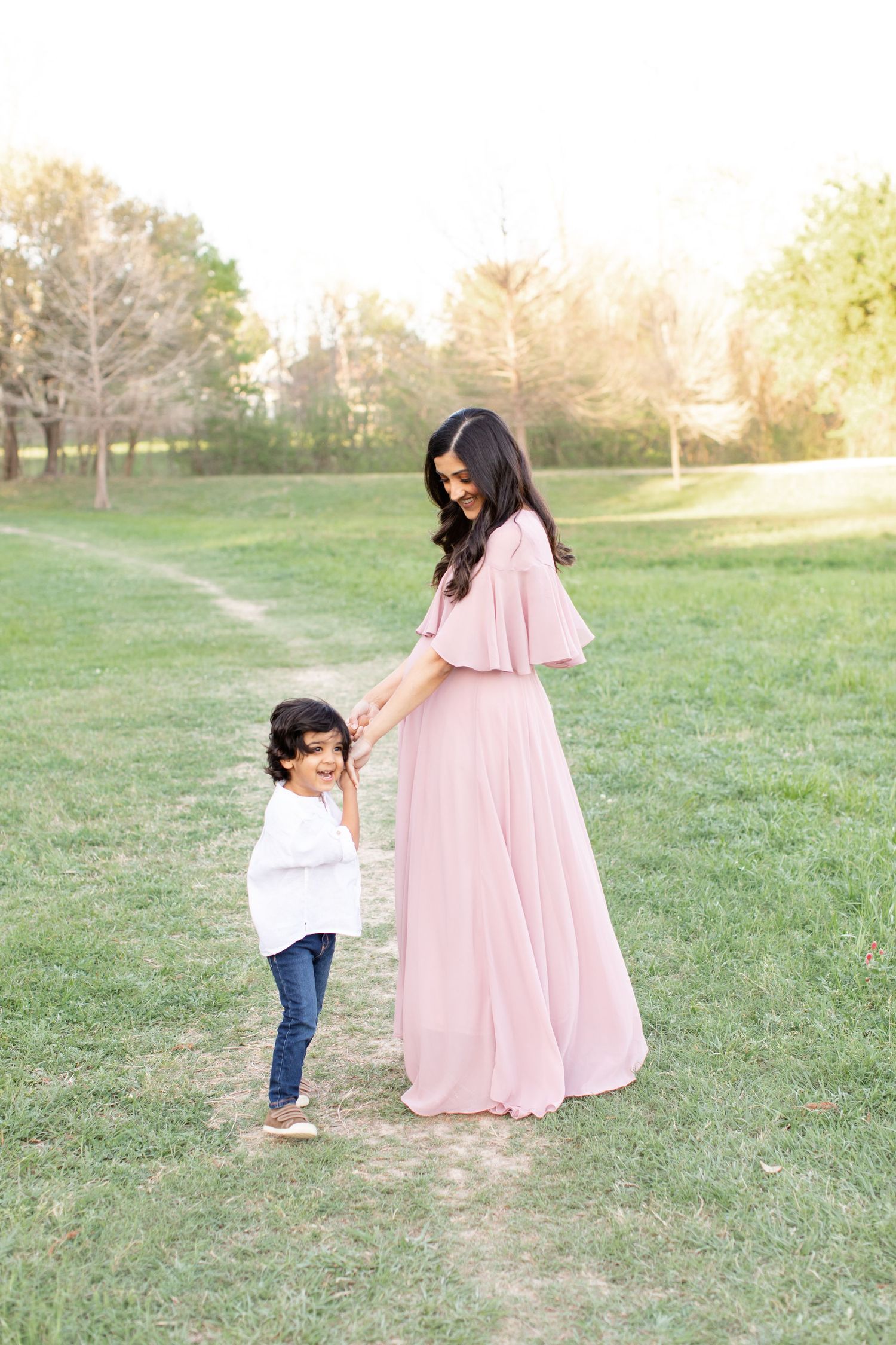 A sweet outdoor moment shows connection between adult and small child.