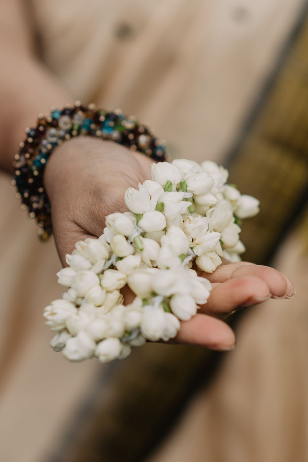 white flowers formed into a band for the bride's hairpiece