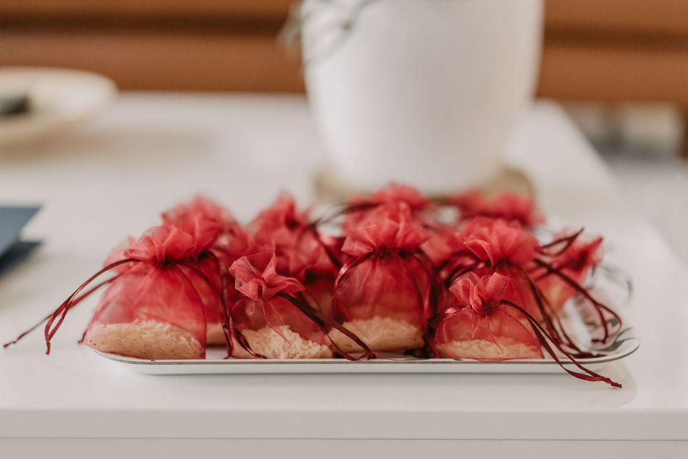 a tray with bags of rice for the guests