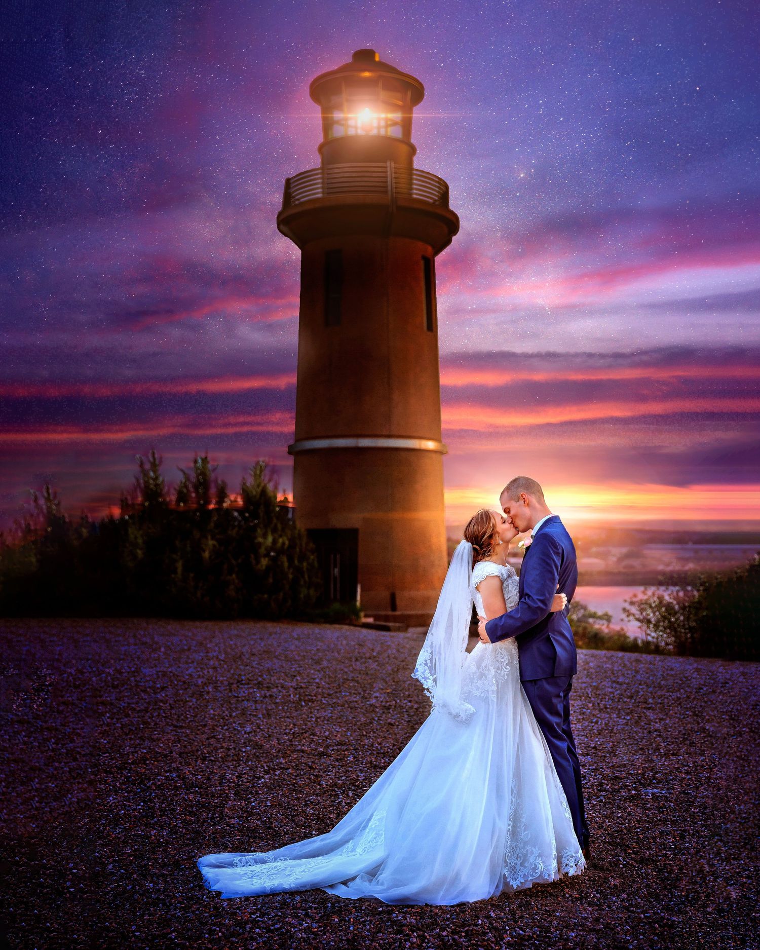 Picture of couple in wedding attire kissing under sunset at lighthouse