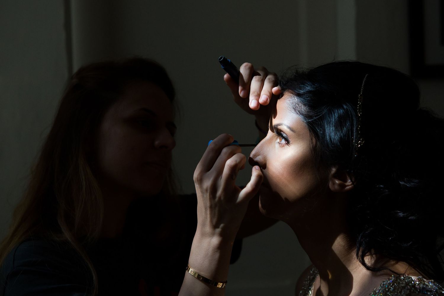 A stunning bridal makeup shot as the sun was shining in through the window in Malta