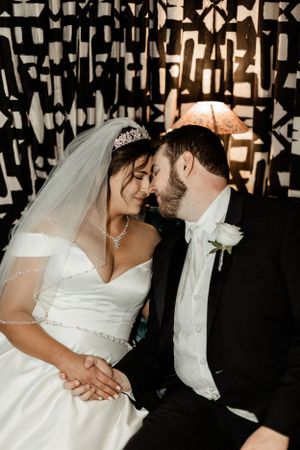 Romantic portrait against artistic black and white geometric wall decor.