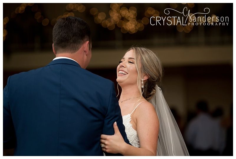 Bride and groom share their first dance together at their wedding reception.