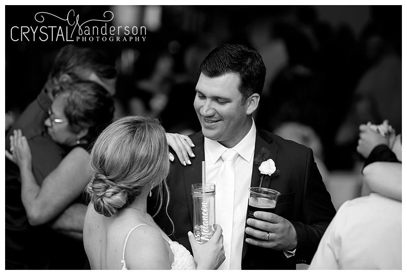 Black and white photos showing emotional moments during wedding reception dances.