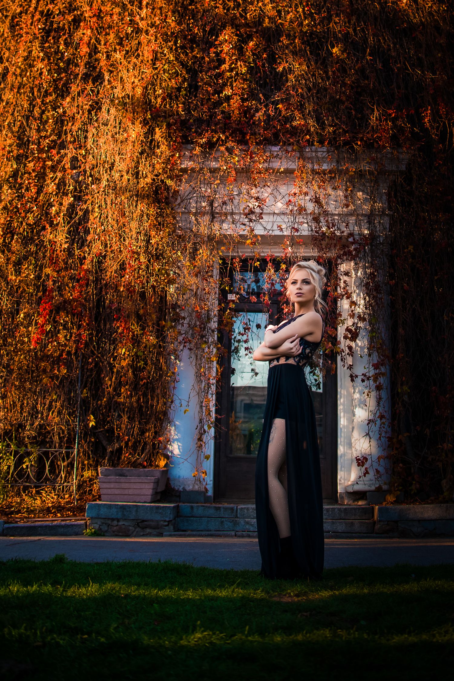 Artistic autumn portrait series against a rustic building with warm orange foliage in the background.