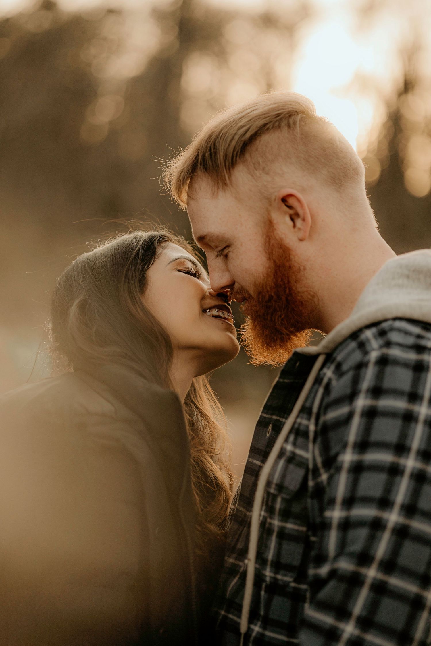 Romantic sunset portraits captured in warm golden light with intimate close-up angles.
