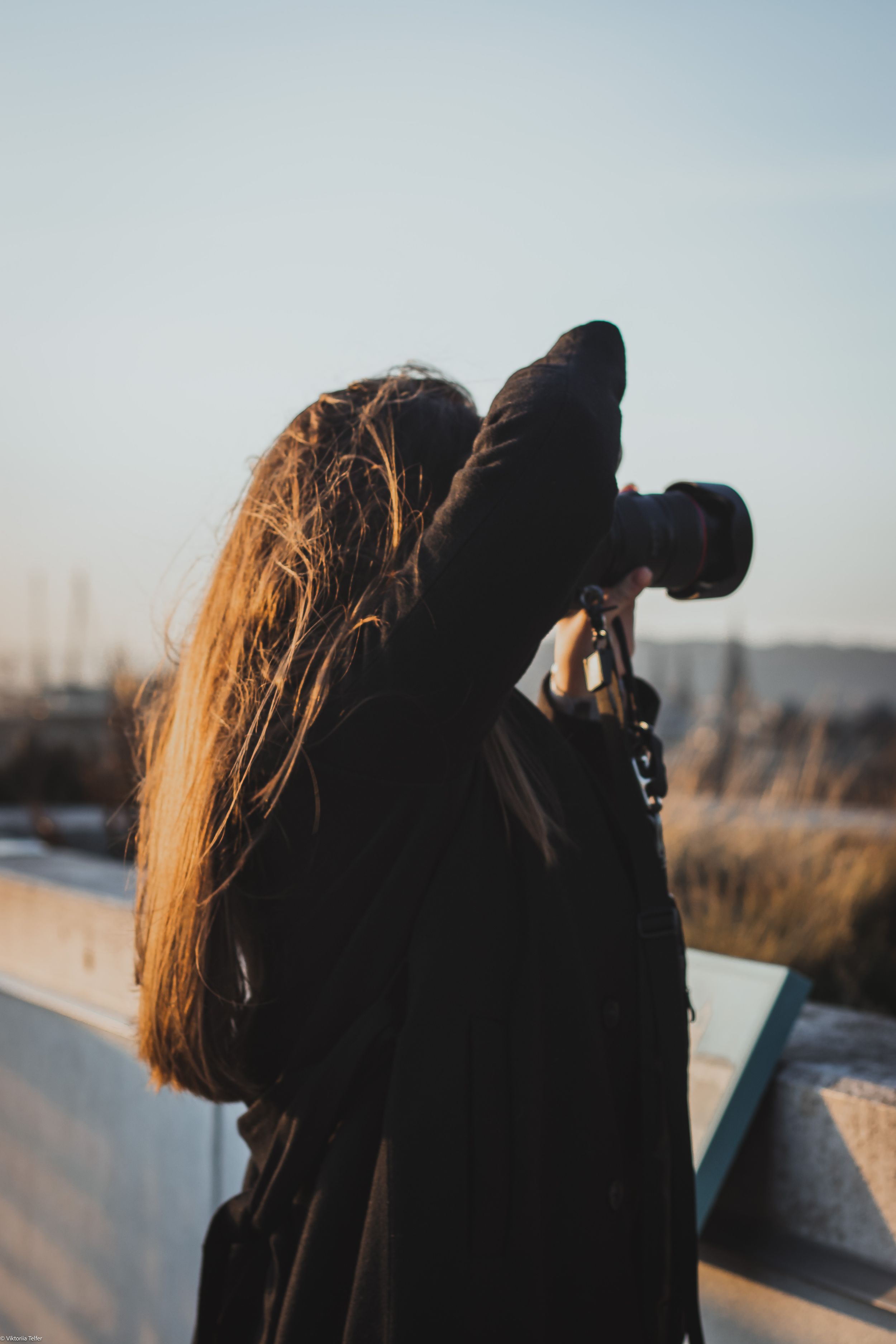 Silhouette of a photographer taking pictures during golden hour.