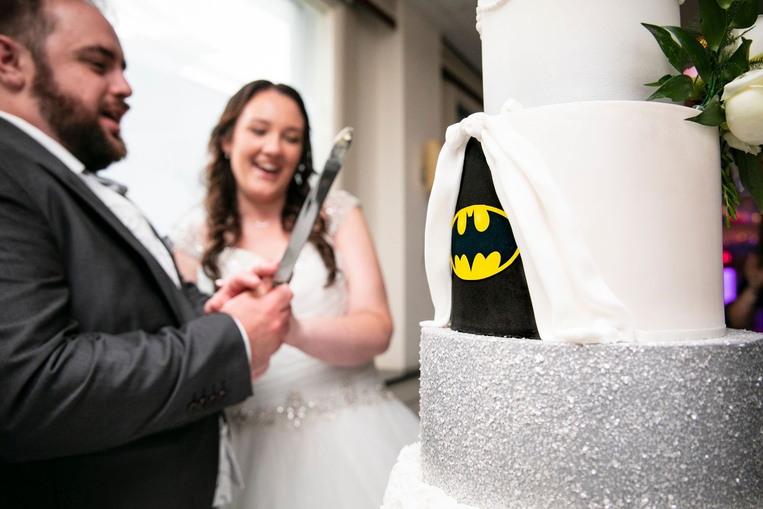 Wedding cake detail shots with silver glitter trim and elegant decorations.