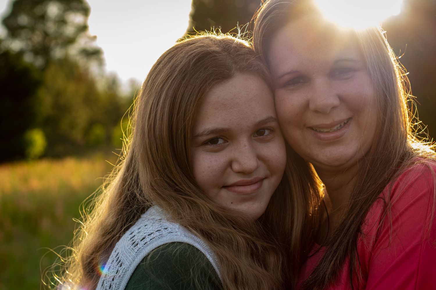 Women and little girl smiling