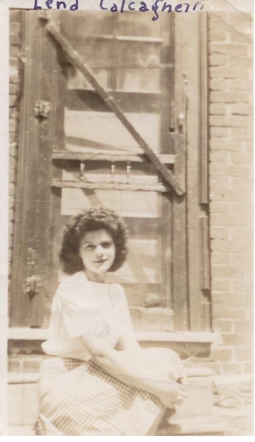 Women at a door sitting on the steps