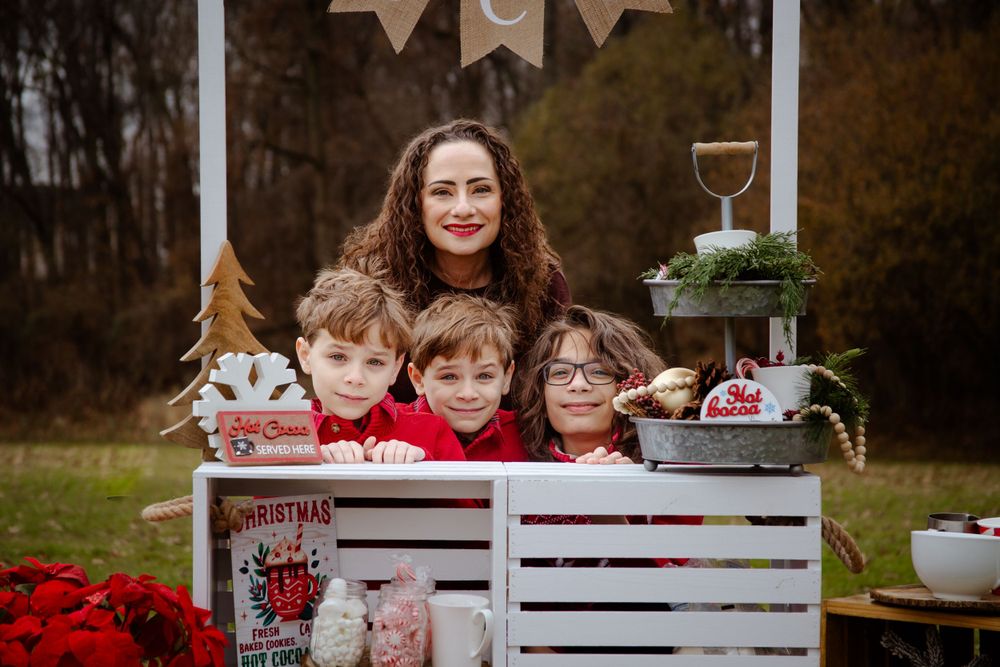 Rustic Christmas scene with decorated wooden crates and holiday ornaments.
