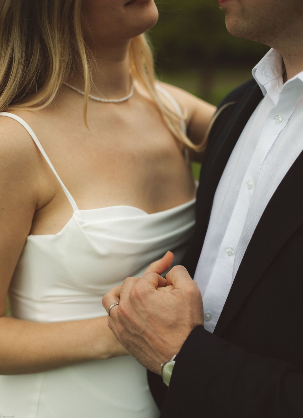 Romantic close-up shot of a couple in formal attire.
