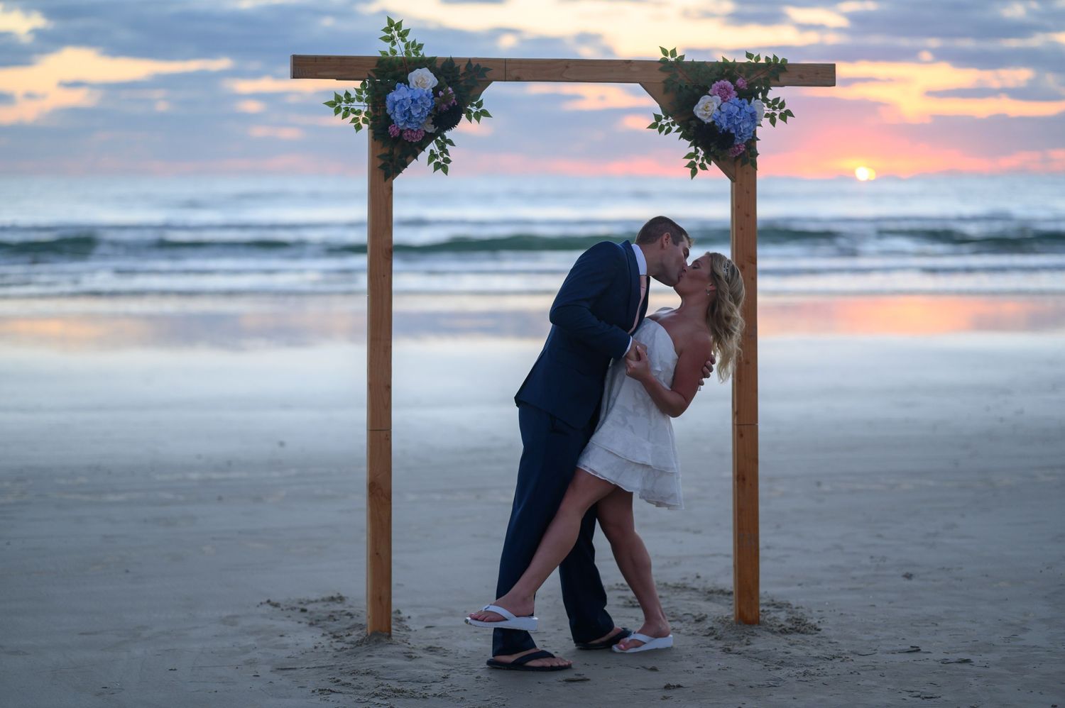 Bride and Groom dip kiss.