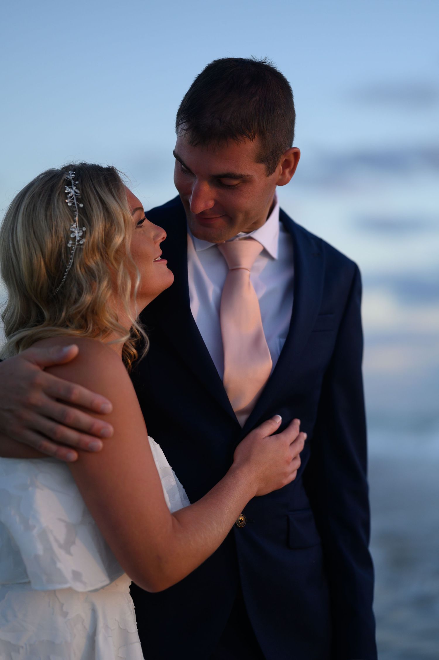 Bride and Groom laugh together.