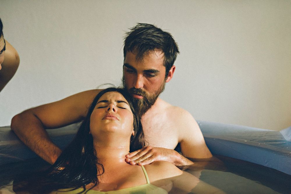 A person receives a relaxing massage treatment on a spa table in a serene setting.