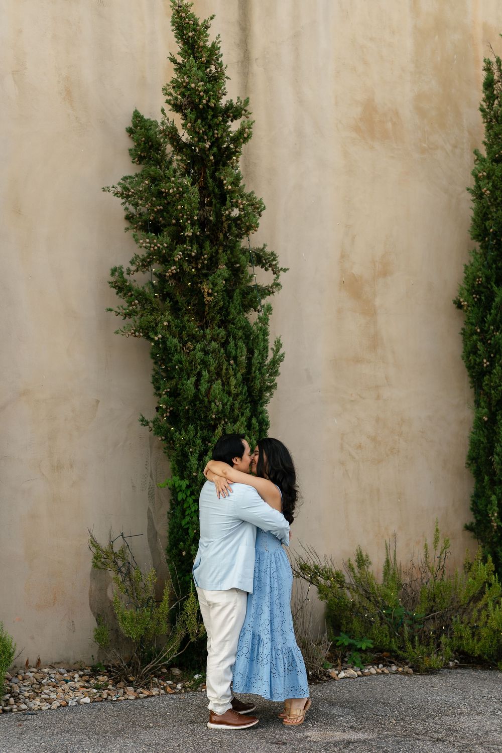 Progressive profile sequence showing someone ducking down and disappearing behind a green bush against a textured wall.
