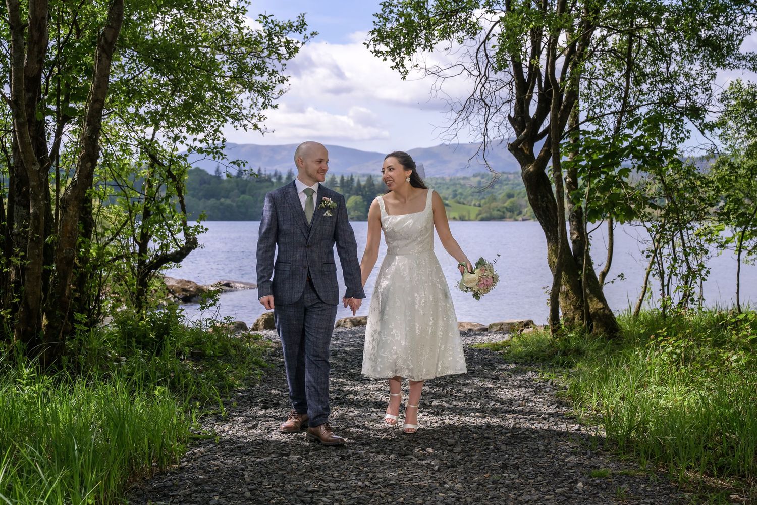 Bride and groom beside Windermere at Cragwood Country House