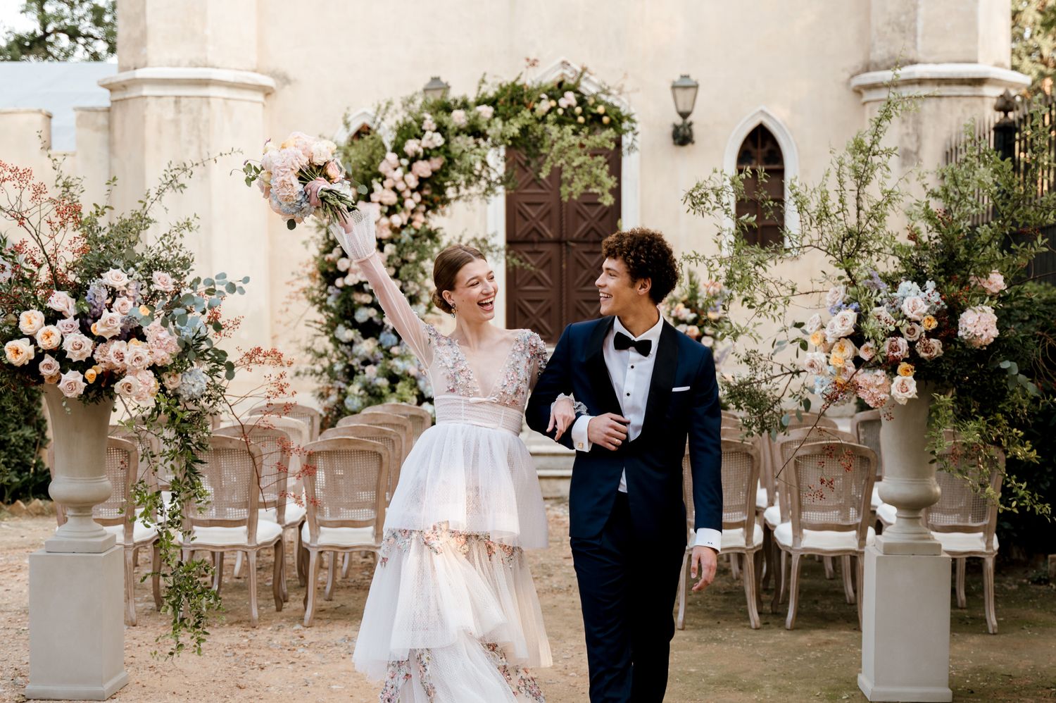 A candid photo of a bride and groom at their whimsical garden wedding in Athens, Greece