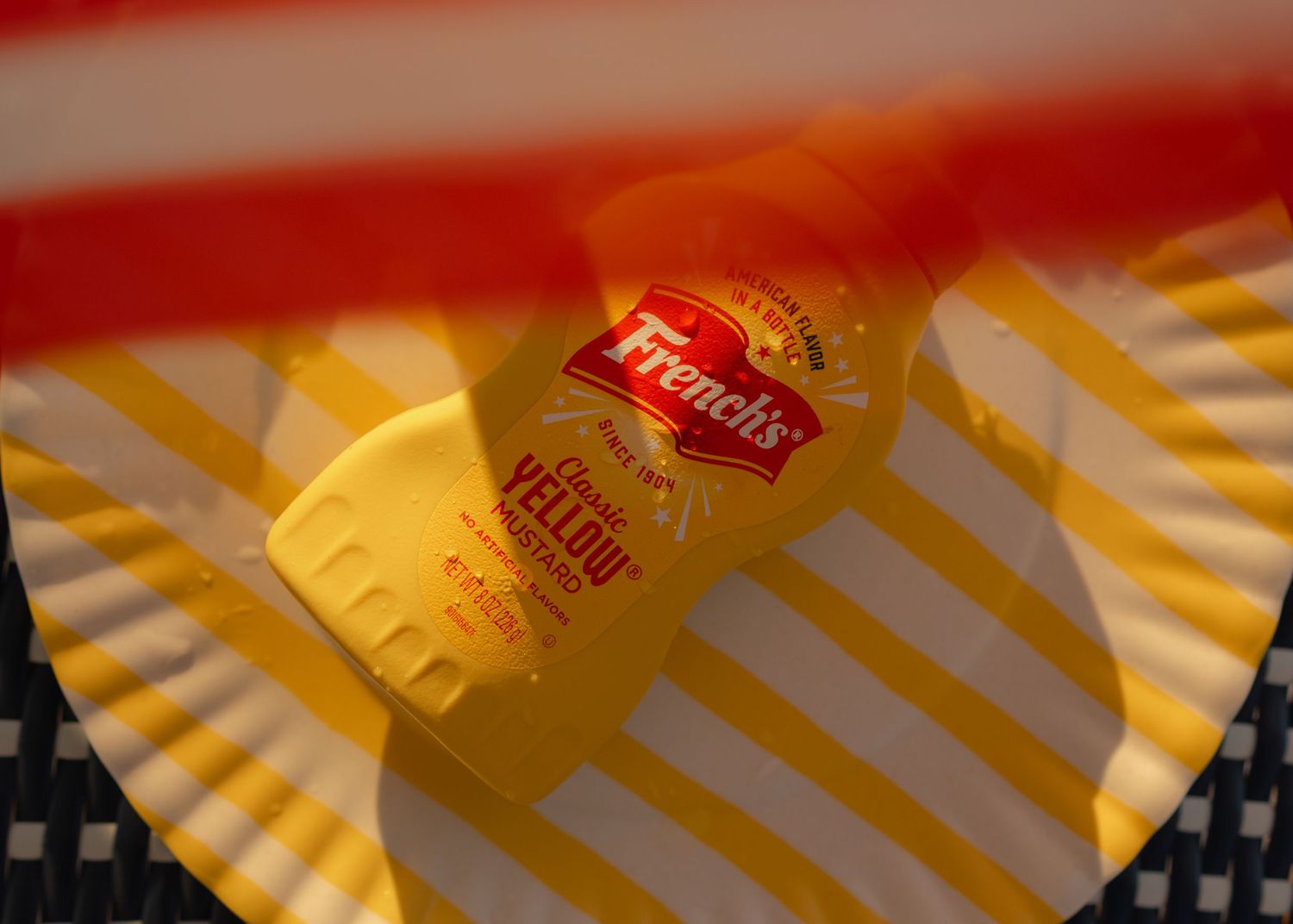 Yellow French's Mustard Jar laying on yellow platter