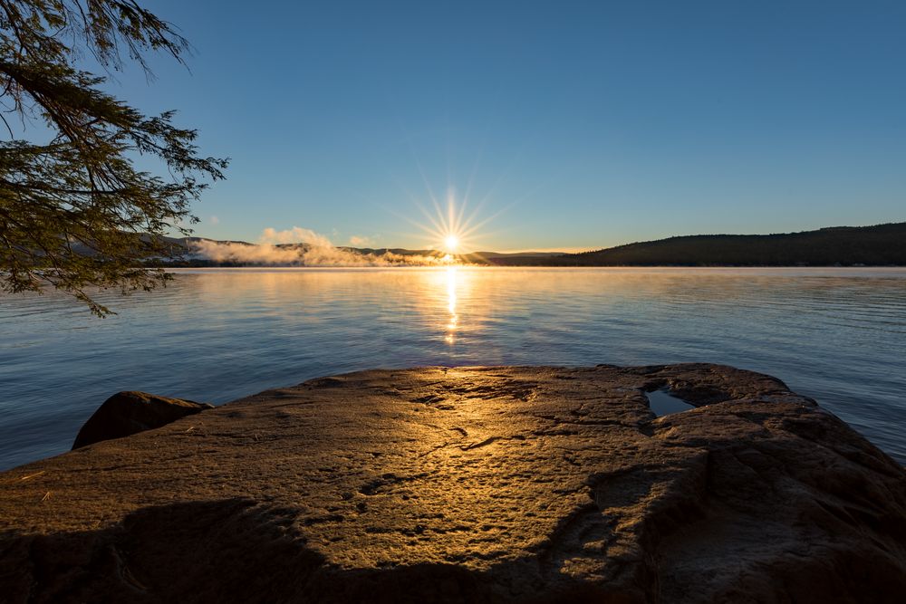 Sunrise landscape photo in Lake George NY with fog in the background