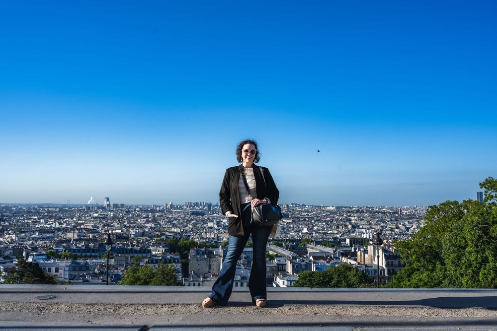 A panoramic series of photos showing scenic views of Paris city skyline from Montmartre on a bright sunny day.