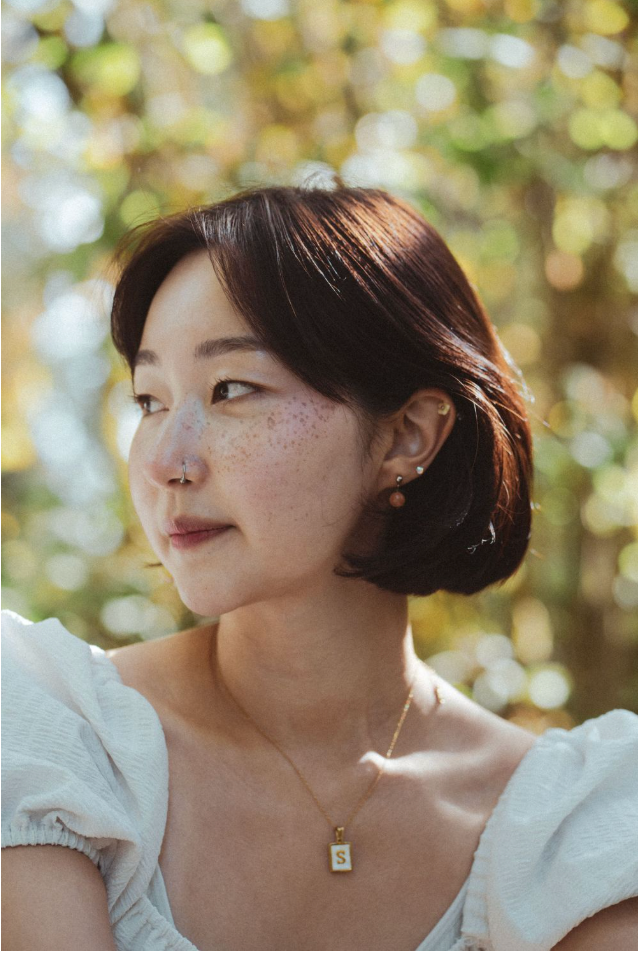 Portrait series of a person outdoors with sunlit bokeh background creating a soft, dreamy autumn atmosphere.