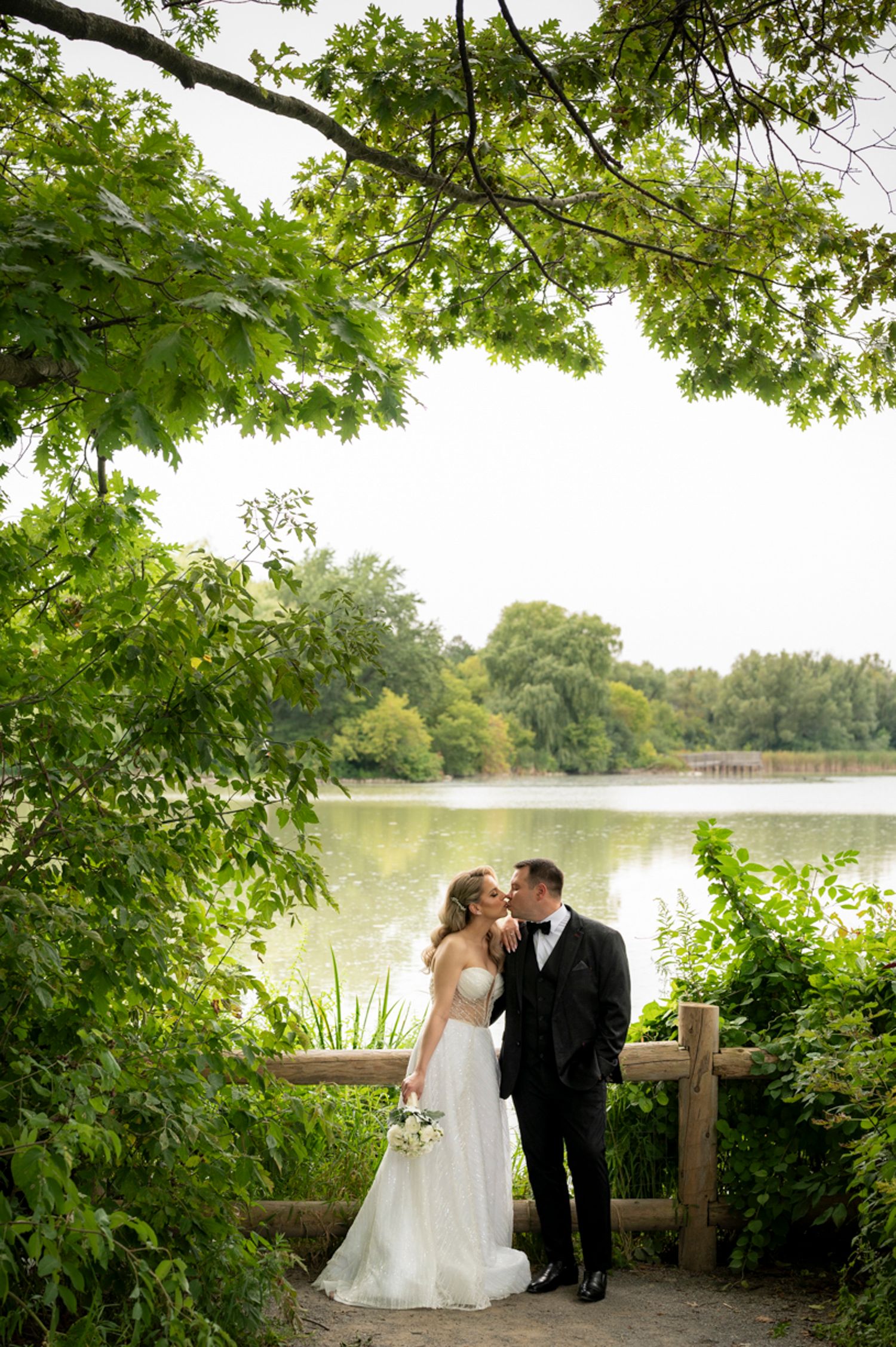 Wedding photo of couple holding hands in Toronto outdoor setting