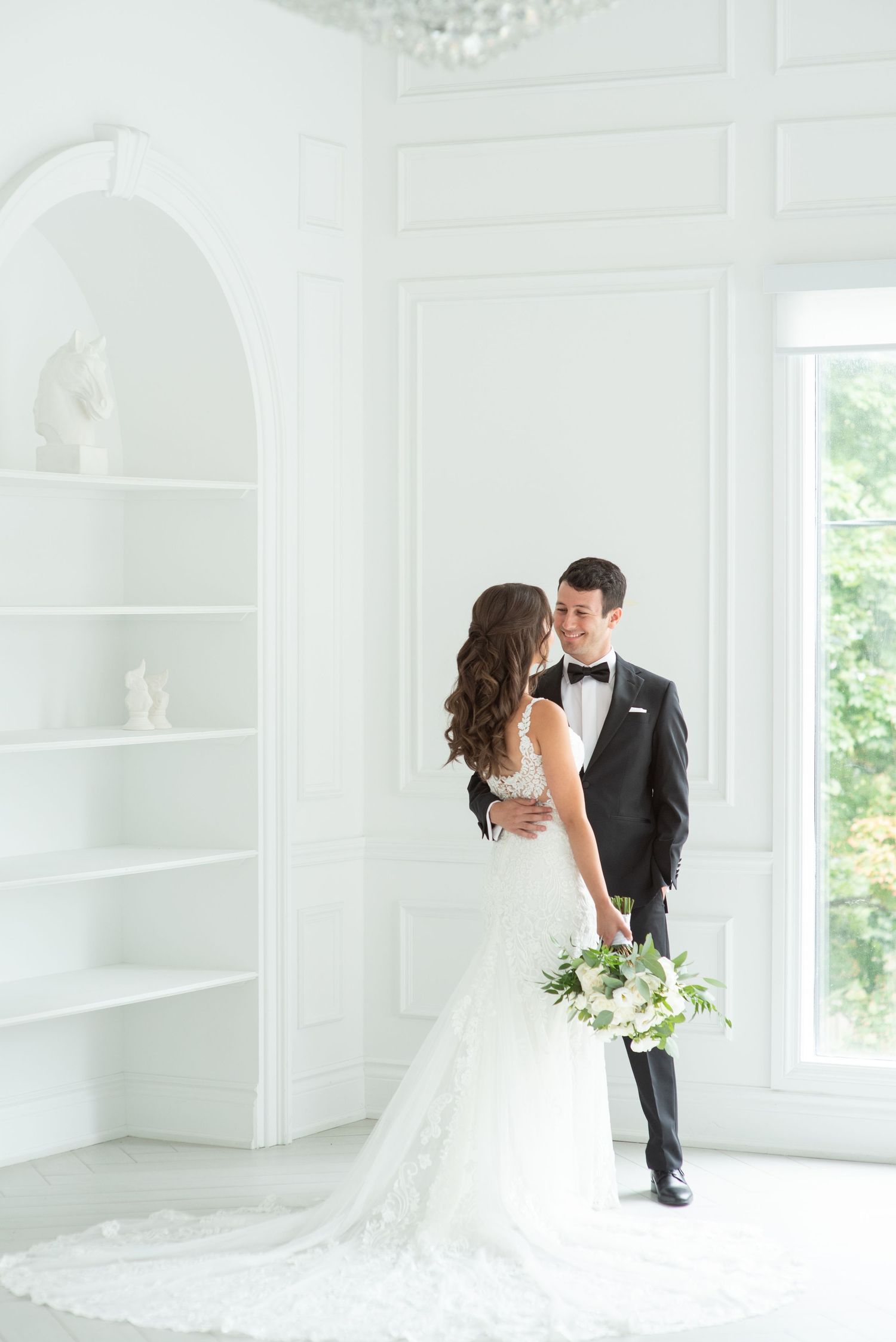 Romantic wedding portrait in studio with creative lighting and styling.