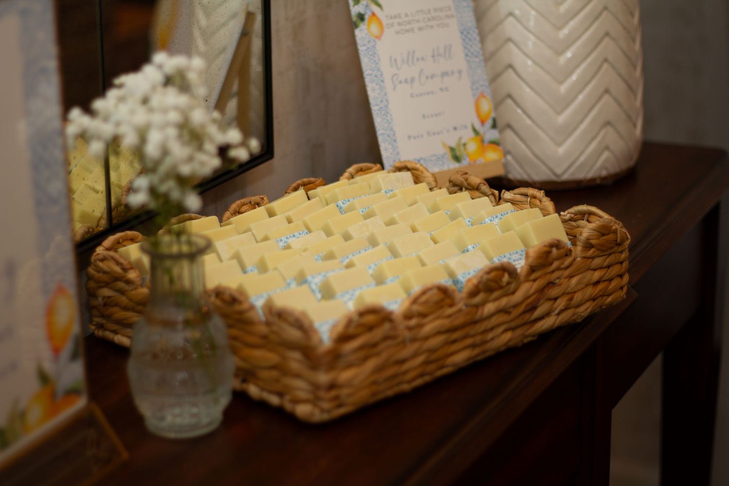 Bridal shower welcome sign featuring watercolor lemons and blue tile pattern border decorations.