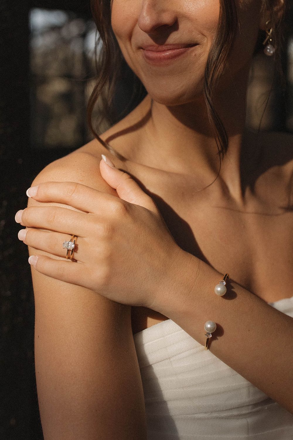 Close-up shots of an engagement ring being showcased on a bride's hand.