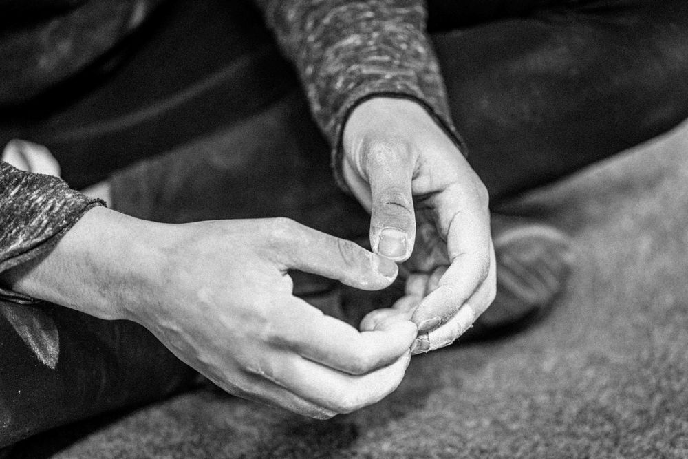 Hands of an American professional rock climber Natalia Grossman trains on an indoor climbing wall in Paris, France.