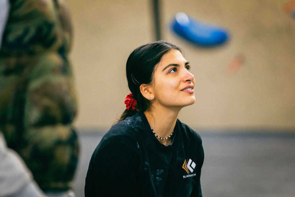 American professional rock climber Natalia Grossman trains on an indoor climbing wall in Paris, France, wearing athletic gear.