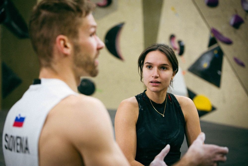 French professional rock climber Oriane BERTONE trains on an indoor climbing wall in Paris, France, wearing athletic gear.