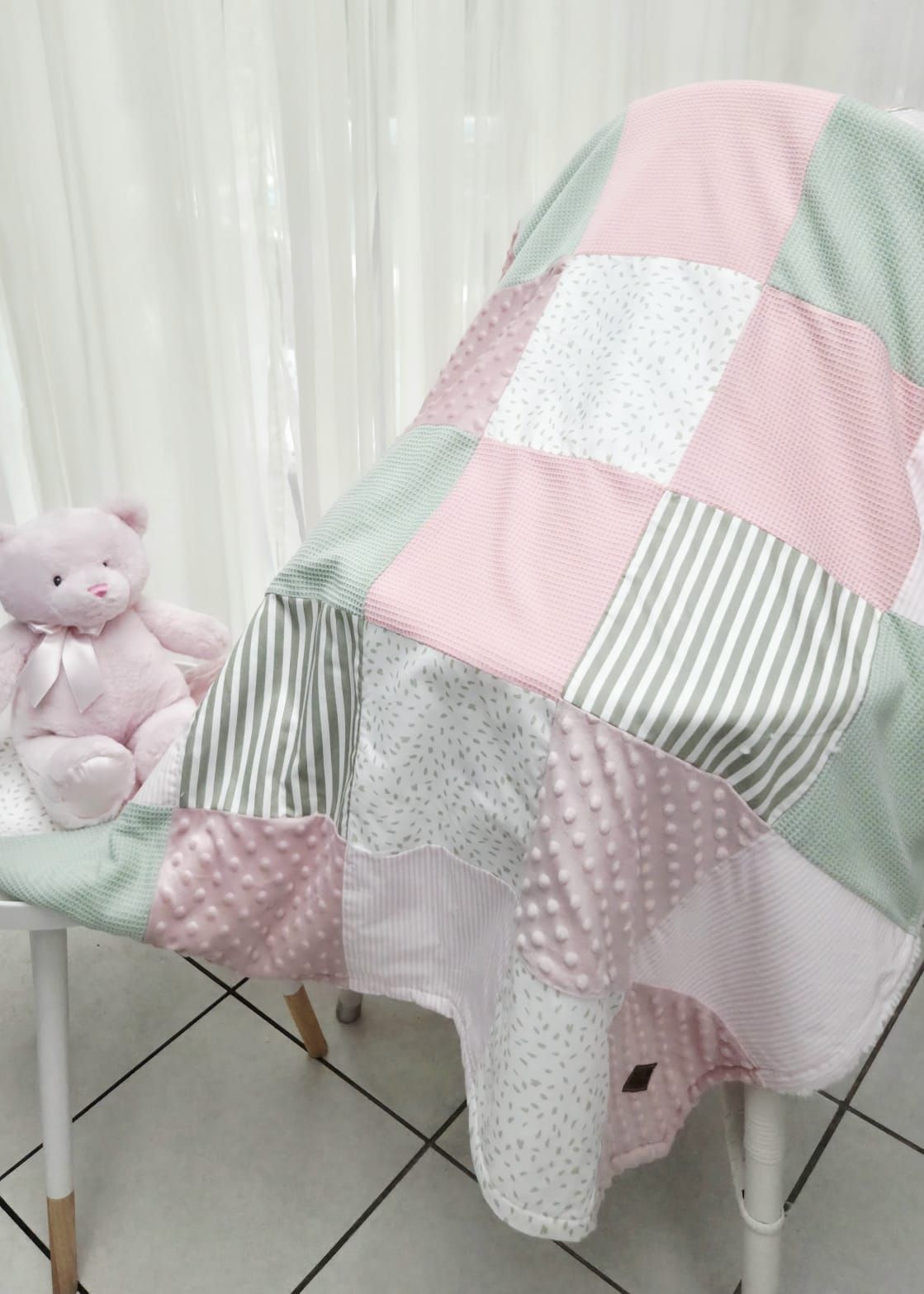 Pink and mint green patchwork baby quilt with teddy bear, featuring stripes, dots, and minky fabric squares.