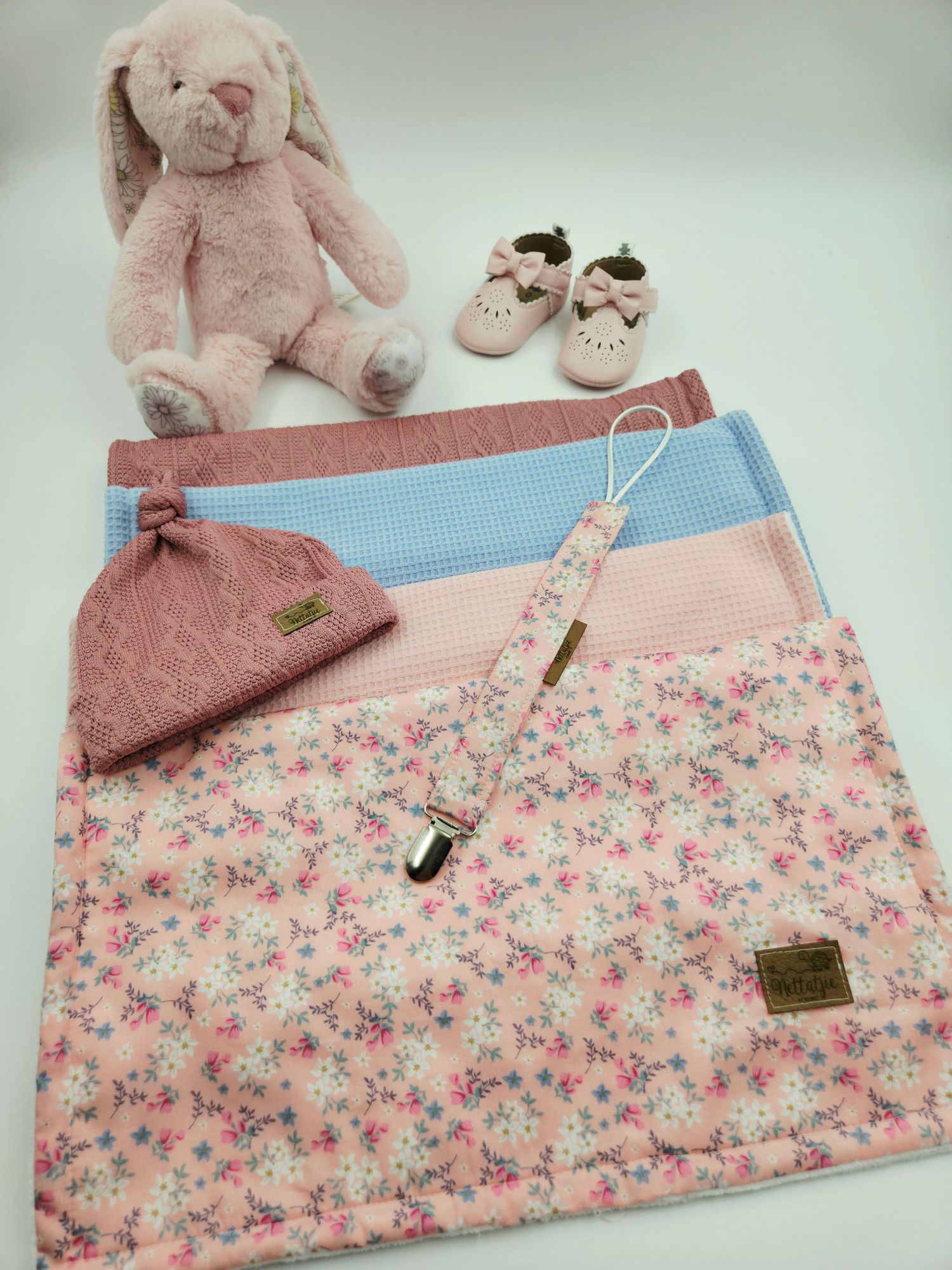 Pink plush bunny with matching floral blankets, baby shoes, and pacifier clip set.