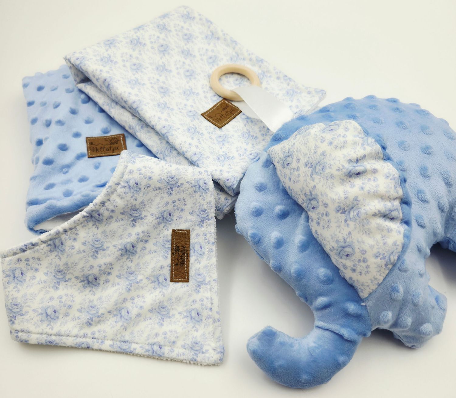 Blue and white patterned baby blanket with minky dot texture.