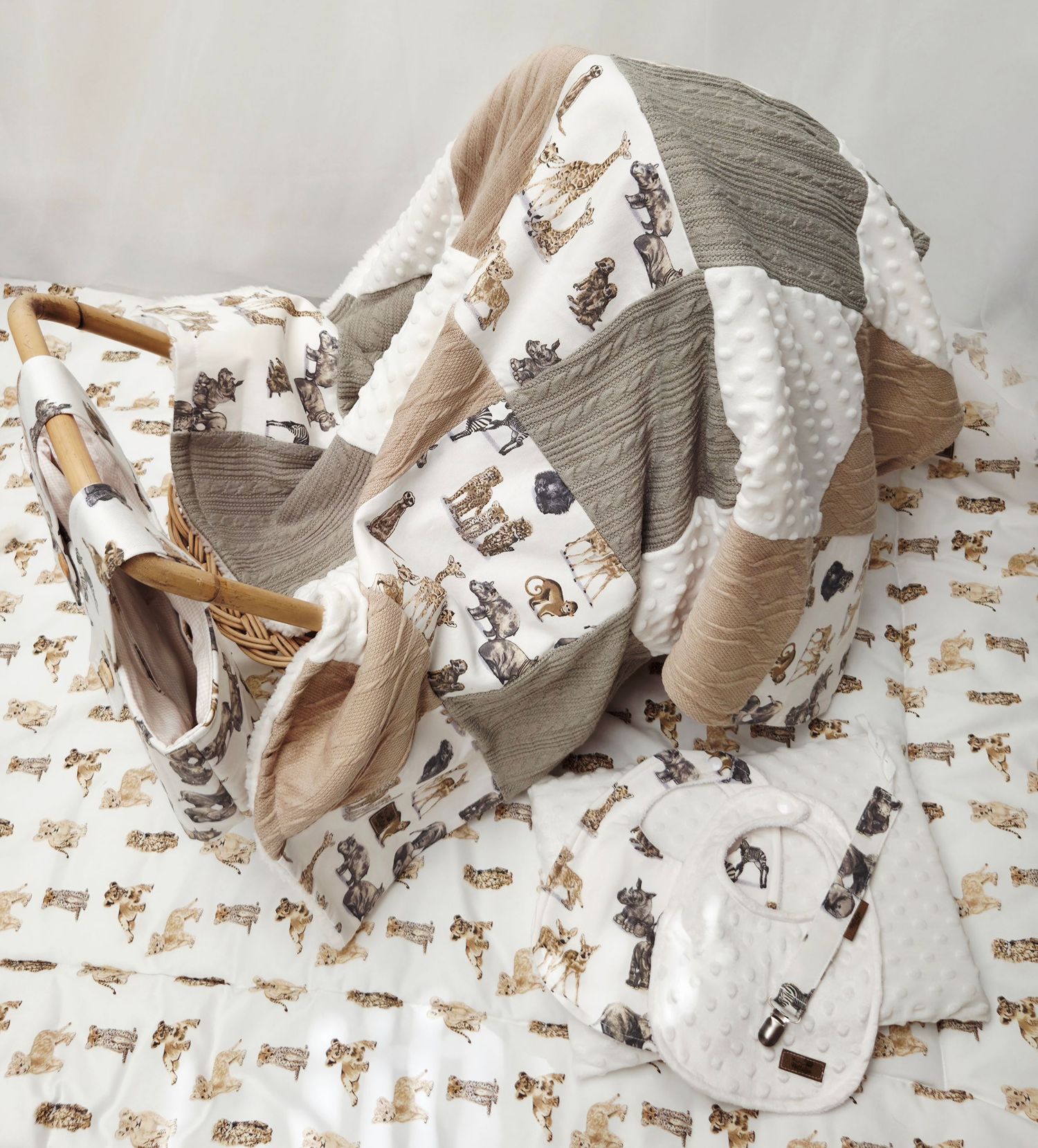Handmade baby quilt set with western cowboy print in neutral beige and white tones, including matching accessories.