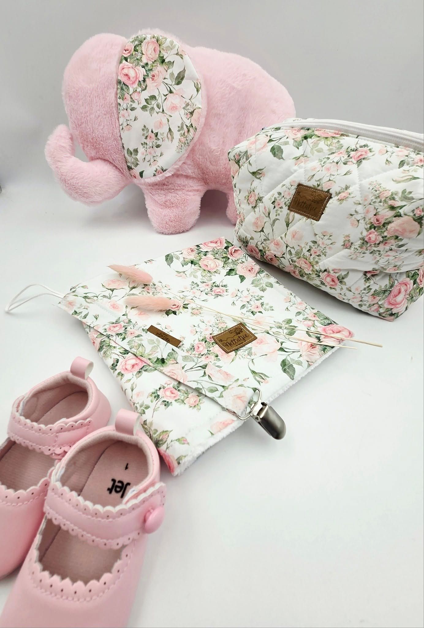 Pink baby set with floral print blanket, plush cushion and mary jane shoes.
