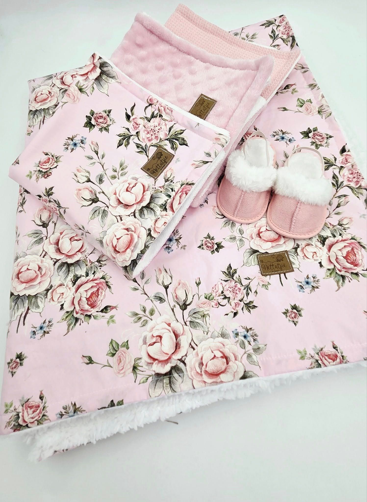 Pink floral baby blanket with vintage rose print and white minky backing.