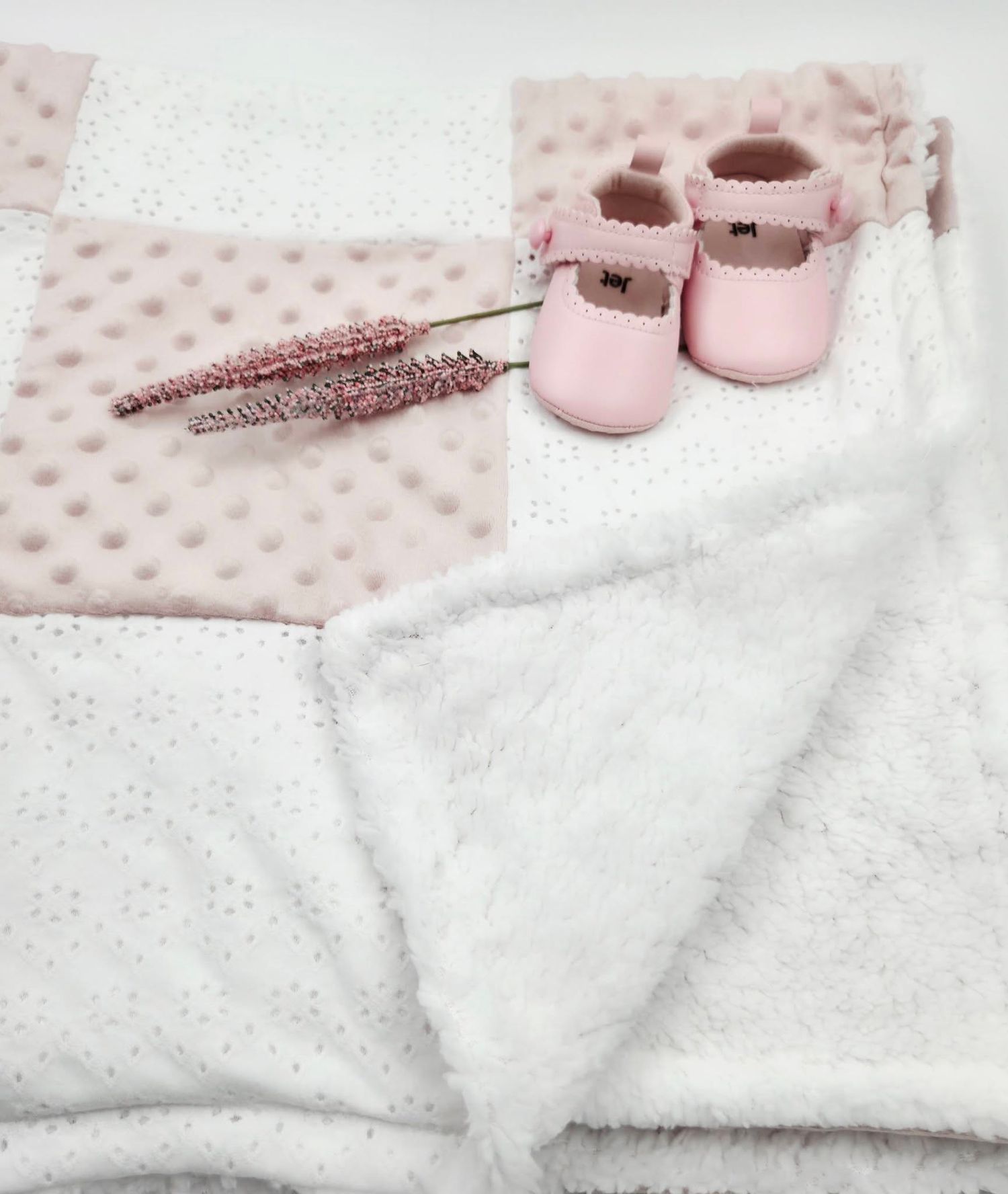 Soft pink and white minky baby blanket set with delicate pink leather Mary Jane shoes and dried lavender sprigs.