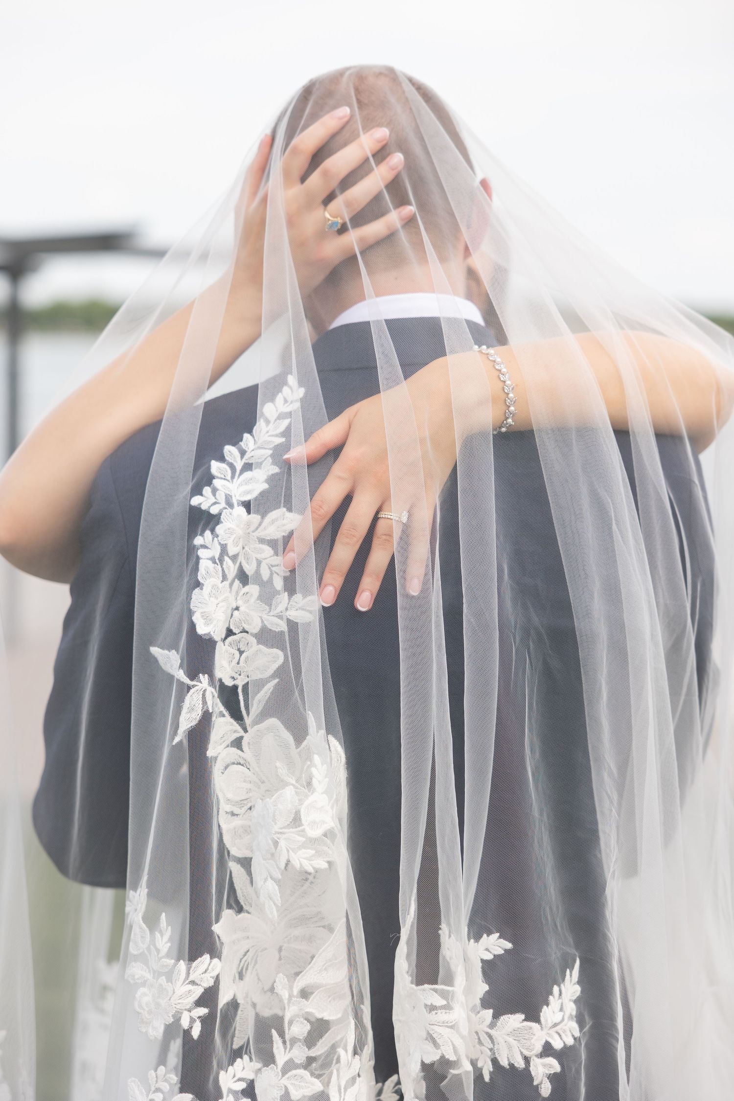 White lace wedding veil details shown in a series of delicate close-up shots against a light background. Rachel Martinez Photography