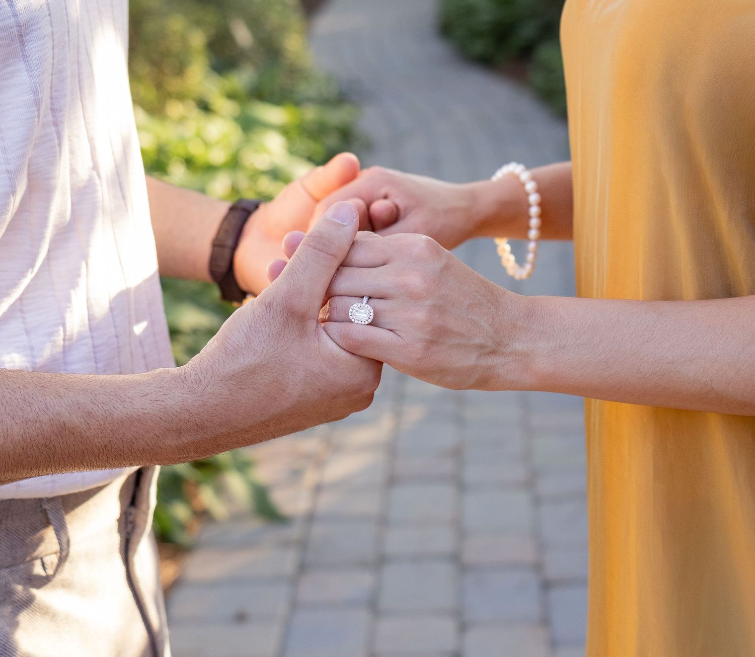 Close-up shots of hands exchanging rings during a special moment.