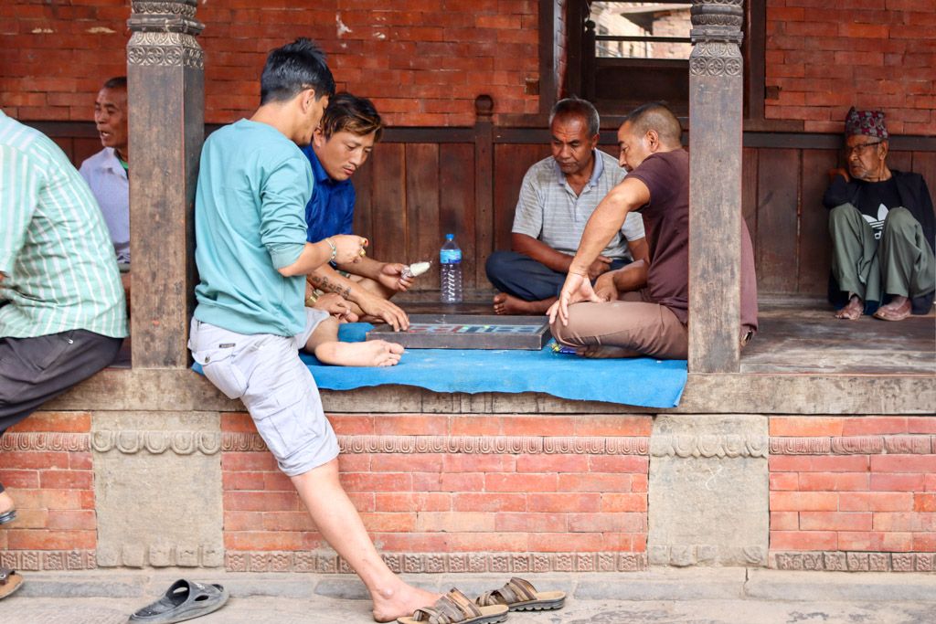 playing games in the street in kathmandu, nepal. street life photography by emma drohan
