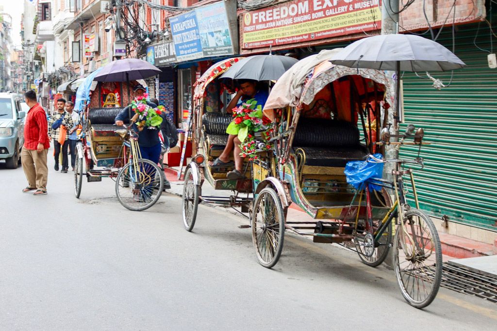 waiting for a rickshaw ride in kathmandu nepal.  travel photography by emma drohan