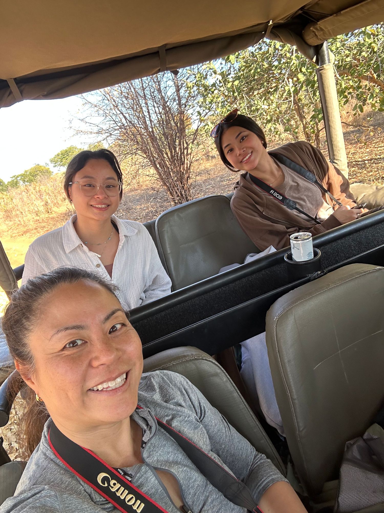 Group taking selfies during a road trip adventure.