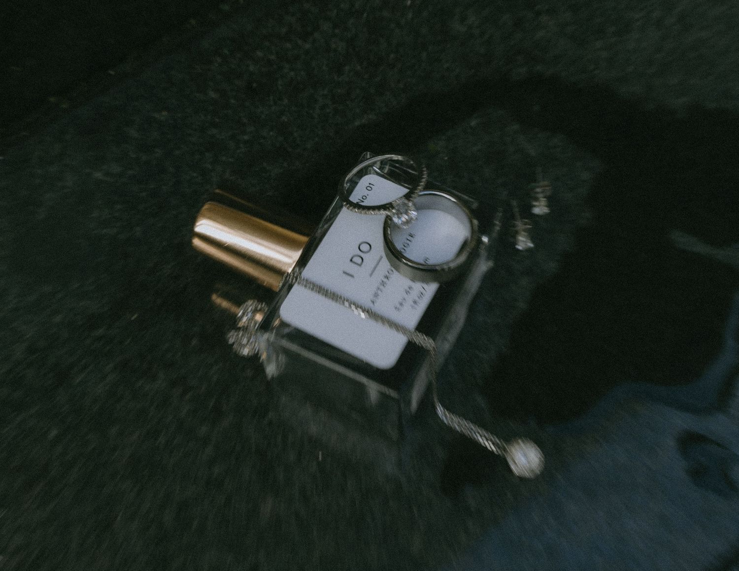 A vintage music box mechanism captured in dark moody lighting.